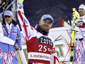 FILE - In this Tuesday, Dec. 29, 2015 file photo, France's David Poisson celebrates his third place after completing a men's World Cup downhill in Santa Caterina Valfurva, Italy. French downhiller David Poisson died on Monday, Nov. 13, 2017 following a training crash in Canada. The French skiing federation said in a statement that the 35-year-old Poisson, who won a bronze medal in the downhill at the 2013 world championships, was training in the Canadian resort of Nakiska for World Cup races in North America. (AP Photo/Alessandro Trovati, file)