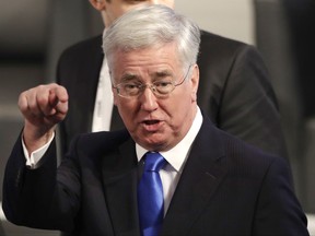 FILE - In this Feb. 17, 2017 file photo, British Defense Secretary Michael Fallon arrives for the Munich Security Conference in Munich, southern Germany. The sexual harassment and assault allegations against Harvey Weinstein that rocked Hollywood and sparked a flurry of allegations in other American industries, as well as the political arena, are reaching far beyond U.S. borders. Emboldened by the women, and men, who have spoken up, the "Weinstein Effect" is rippling across the globe. In the immediate aftermath of the Weinstein revelations, the British government led by Prime Minister Theresa May has been rocked by a series of harassment allegations that have led to Fallon's resignation. (AP Photo/Matthias Schrader, File)