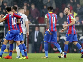 Crystal Palace's James McArthur, right, celebrates scoring his side's first goal of the game during the English Premier League soccer match Crystal Palace versus Everton at Selhurst Park, London, Saturday Nov. 18, 2017. (Steven Paston/PA via AP)