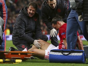 FILE - In this file photo dated Thursday, April 20, 2017, Manchester United's Zlatan Ibrahimovic is checked before being taken off with an injury during the Europa League quarterfinal second leg soccer match between Manchester United and Anderlecht at Old Trafford stadium, in Manchester, England.  Manchester United manager Jose Mourinho says Zlatan Ibrahimovic is in contention to play against Newcastle on upcoming Saturday after he sustained serious knee injuries in the Europa League match against Anderlecht. (AP Photo/Dave Thompson, FILE)