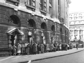 FILE - In this B/W file photo dated Oct. 27, 1960,  a queue forms outside The Old Bailey Central Criminal Court, in London, for admission to the public gallery where the "Lady Chatterley's Lover" case is resuming.  The towering legal figure who helped liberalize British laws around sex and freedom of expression, successfully defending Penguin Books against obscenity charges for publishing D.H. Lawrence's novel "Lady Chatterley's Lover", the lawyer Jeremy Hutchinson died Monday Nov. 13, 2017, aged 102. (AP Photo, FILE)