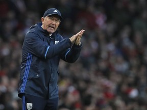 FILE - In this file photo dated Monday, Dec. 26, 2016,  West Brom's manager Tony Pulis gestures during the English Premier League soccer match between Arsenal and West Bromwich Albion at Emirates stadium in London. Pulis is under pressure with the team one point above the relegation zone, as the club's fans have seemingly lost patience with their run of two wins in its last 20 league games. (AP Photo/Kirsty Wigglesworth, FILE)