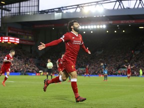 Liverpool's Mohamed Salah celebrates scoring his side's second goal of the game  during the English Premier League soccer match Liverpool versus Southampton at Anfield, Liverpool, England, Saturday Nov. 18, 2017. (Peter Byrne/PA via AP)