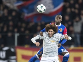 Basel's Eder Balanta up, fights for the ball against Manchester United's Marouane Fellaini, during the Champions League Group A soccer match between Switzerland's FC Basel 1893 and England's Manchester United at the St. Jakob-Park stadium in Basel, Switzerland, Wednesday, Nov. 22, 2017. (Ennio Leanza/Keystone via AP)