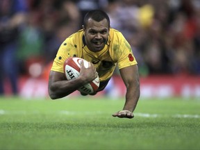 Australia's Kurtley Beale scores a try  against Wales, during their Autumn International match at the Principality Stadium in Cardiff, Wales, Saturday Nov. 11, 2017. (Mike Egerton/PA via AP)