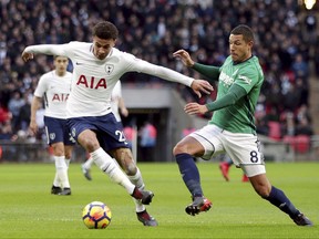 Tottenham Hotspur's Dele Alli, left, and West Bromwich Albion's Jake Livermore in action during their English Premier League soccer match at Wembley Stadium in London, Saturday Nov. 25, 2017. (Yui Mok/PA via AP)