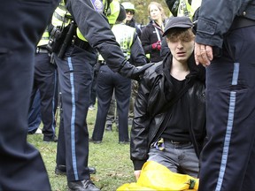 Boston police detain a protestor during Boston's Free Speech Rally held on the Boston Common. Saturday, Nov.  18, 2017 in Boston. . Boston police confirmed the arrests of two counter-protesters Saturday at the "Rally for the Republic" event planned by conservative groups Resist Marxism and Boston Free Speech on the Common.   (Mark Lorenz/The Boston Herald via AP)