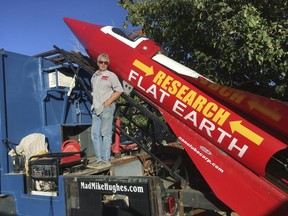 In this Wednesday, Nov. 15, 2017, photograph, daredevil/limousine driver Mad Mike Hughes is shown with with his steam-powered rocket constructed out of salvage parts on a five-acre property that he leases in Apple Valley, Cal.