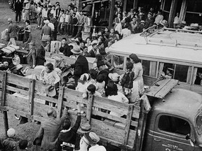 In this 1942, Japanese-Canadians are relocated to the B.C. interior in the back of trucks.