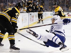 Toronto Maple Leafs' William Nylander, right, falls after being checked by Boston Bruins' Torey Krug (47) during the first period of an NHL hockey game in Boston, Saturday, Nov. 11, 2017. ((AP Photo/Michael Dwyer)