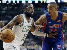 Boston Celtics' Kyrie Irving (11) drives past Detroit Pistons' Avery Bradley (22) during the first quarter of an NBA basketball game in Boston, Monday, Nov. 27, 2017. (AP Photo/Michael Dwyer)