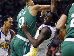 Golden State Warriors' Draymond Green, right, fouls Boston Celtics' Jayson Tatum, left, during the second quarter of an NBA basketball game in Boston, Thursday, Nov. 16, 2017. (AP Photo/Michael Dwyer)