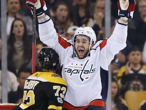 Washington Capitals' Tom Wilson, right, celebrates his goal, next to Boston Bruins' Charlie McAvoy (73) during the second period of an NHL hockey game in Boston, Saturday, Nov. 4, 2017. (AP Photo/Michael Dwyer)