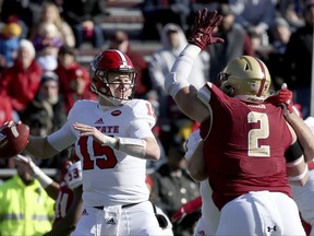 North Carolina State quarterback Ryan Finley (15) drops back to pass as Boston College defensive end Zach Allen (2) applies pressure during the first half of an NCAA college football game Saturday, Nov. 11, 2017, in Boston. (AP Photo/Mary Schwalm)