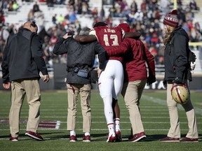 Boston College quarterback Anthony Brown (13) is helped off the field after getting injured during the first half of an NCAA college football game against North Carolina State Saturday, Nov. 11, 2017, in Boston. (AP Photo/Mary Schwalm)