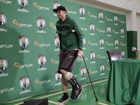 Boston Celtics' Gordon Hayward uses crutches as he steps away from a podium after taking questions from members of the media at an NBA basketball news conference, Thursday, Nov. 2, 2017 at the team's' training facility in Waltham, Mass. Hayward, who broke his ankle about 5 minutes into his NBA career opener at Cleveland on Oct. 17, says he knows he will not play again this season, after needing surgery to repair the injury. (AP Photo/Steven Senne)