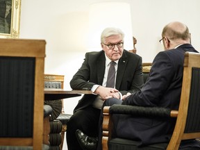 In this picture released by the German government's press office, President  Frank-Walter Steinmeier, left, meets with the Chairman of the German Social Democratic Party, Martin Schulz,  in Bellevue palace in Berlin, Thursday, Nov. 23, 2017.  (Jesco Denzel /Government's Press Office via AP)