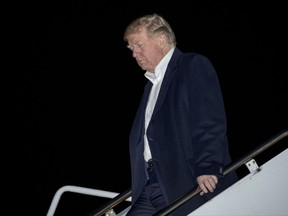 CORRECTS DATE TO TUESDAY, NOV. 14, 2017- President Donald Trump arrives at Andrews Air Force Base, Md., Tuesday, Nov. 14, 2017, to board Marine One for a short trip to the White House. Trump returns from a five country trip through Asia traveling to Japan, South Korea, China, Vietnam and the Philippines. (AP Photo/Andrew Harnik)