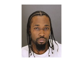 Allen Hosea Johnson Jr. is seen in an undated photo provided by the Baltimore Police Department. Johnson Jr. was charged with with attempted murder and other offenses after a Baltimore police officer was shot in his hand during a struggle in Baltimore Wednesday, Nov. 29, 2017. (Baltimore Police Department via AP)