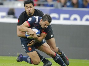New Zealand's Rieko Ioane, left, tackles France's Nans Ducuing during a rugby union international match at Stade de France stadium in Saint Denis, outside Paris, France, Saturday, Nov. 11, 2017. (AP Photo/Michel Euler)