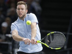 Jack Sock of the United States returns the ball to Filip Krajinovic of Serbia during their final match of the Paris Masters tennis tournament at the Bercy Arena in Paris, France, Sunday, Nov. 5, 2017. (AP Photo/Michel Euler)