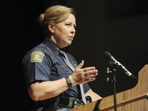 FILE--This Oct. 1, 2015, file photo shows Michigan State Police Director Col. Kriste Kibbey Etue leading a focus group discussion  at Benton Harbor High School, in Benton Harbor, Mich.  Michigan State Police received about 50 separate citizen complaints over Director Col. Kriste Kibbey Etue's decision to share a Facebook post that called NFL players who kneel during the national anthem "anti-American degenerates." The phone calls and emails were disclosed Wednesday, Nov. 1, 2017, in an internal affairs report released in response to a public records request by The Associated Press. (Don Campbell/The Herald-Palladium via AP) MANDATORY CREDIT