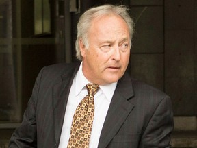 Michel Girouard leaves a courthouse in Quebec City in May 2015.