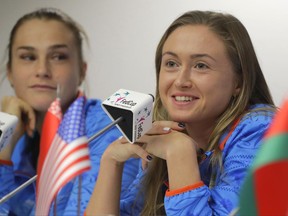 Belarus' Fed Cup team member Aliaksandra Sasnovich, right, speaks, as Aryna Sabalenka looks on during a press conference prior to the Fed Cup by BNP Paribas Final matches between Belarus and USA, in Minsk, Wednesday, Nov. 8, 2017. The matches will take place Nov. 11 - 12, 2017. (AP Photo/Sergei Grits)