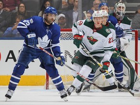 Toronto Maple Leafs centre Nazem Kadri (left) looks to tip a shot against the Minnesota Wild on Nov. 8.