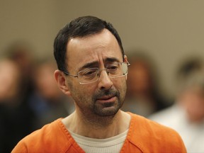 Dr. Larry Nassar appears in court for a plea hearing in Lansing, Mich., Wednesday, Nov. 22, 2017. Nasser, a sports doctor accused of molesting girls while working for USA Gymnastics and Michigan State University, pleaded guilty to multiple charges of sexual assault and will face at least 25 years in prison. (AP Photo/Paul Sancya)