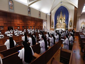 In this Nov. 14, 2017 photo, sisters sing at the Dominican Sisters of Mary, Mother of the Eucharist chapel in Ann Arbor, Mich. The sisters are part of a 130-member Catholic order with a third album titled, "Jesu, Joy of Man's Desiring: Christmas with the Dominican Sisters of Mary."  (AP Photo/Paul Sancya)