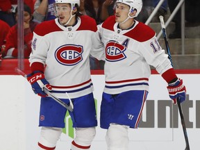 Montreal Canadiens right wing Brendan Gallagher, right, celebrates his goal against the Detroit Red Wings with Charles Hudon in the third period of an NHL hockey game Thursday, Nov. 30, 2017, in Detroit. (AP Photo/Paul Sancya)