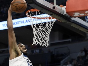 Minnesota Timberwolves center Karl-Anthony Towns (32) dunks against the Dallas Mavericks during the first half of an NBA basketball game on Saturday, Nov. 4, 2017, in Minneapolis. The Timberwolves won 112-99. (AP Photo/Hannah Foslien)