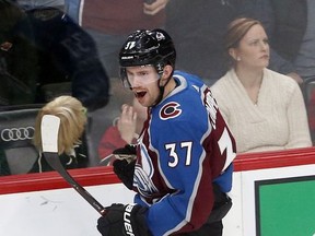 Colorado Avalanche's J.T. Compher celebrates his shorthanded goal off Minnesota Wild goalie Alex Stalock in the first period of an NHL hockey game Friday, Nov. 24, 2017, in St. Paul, Minn. (AP Photo/Jim Mone)