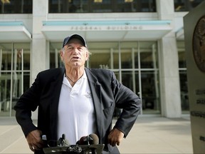 FILE - In this Tuesday, Oct. 20, 2015, file photo, former Minnesota Gov. Jesse Ventura talks to reporters at the Warren E. Burger Federal Building and United States Courthouse after a defamation hearing, in St. Paul, Minn. Ventura and the estate of "American Sniper" author Chris Kyle are apparently working toward a settlement in Ventura's yearslong defamation case. (Elizabeth Flores/Star Tribune via AP)