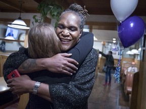 Andrea Jenkins hugs a supporter as she won the Minneapolis Ward 8: Council Member race in Minneapolis on Tuesday, Nov. 7, 2017. (Carlos Gonzalez/Star Tribune via AP)
