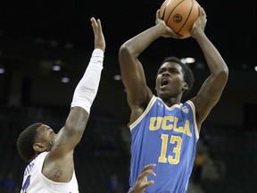 UCLA's Kris Wilkes (13) shoots under pressure from Creighton's Marcus Foster during the first half of an NCAA college basketball game in the Hall of Fame Classic, Monday, Nov. 20, 2017, in Kansas City, Mo. (AP Photo/Charlie Riedel)