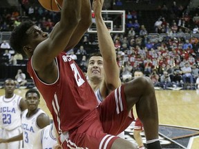 Wisconsin's Khalil Iverson dunks the ball during the first half of an NCAA college basketball game against UCLA in the Hall of Fame Classic, Tuesday, Nov. 21, 2017, in Kansas City, Mo. (AP Photo/Charlie Riedel)