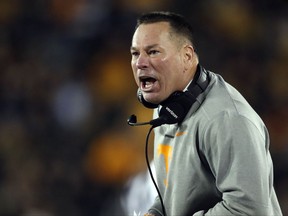 Tennessee head coach Butch Jones yells from the sideline during the first half of an NCAA college football game against Missouri, Saturday, Nov. 11, 2017, in Columbia, Mo. (AP Photo/Jeff Roberson)