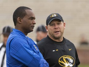 Missouri head coach Barry Odom, right, talks with Florida head coach Randy Shannon, left, before the start of an NCAA college football game Saturday, Nov. 4, 2017, in Columbia, Mo. (AP Photo/L.G. Patterson)
