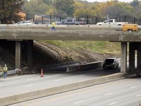 Work continues on the Department of Transportation's Main Street bridge project in Grandview, Mo., Thursday, Nov. 2, 2017. The revenue generated by a 2004 voter-approved initiative in Missouri to fund better highways and bridges has not been enough to cover the bond payments it authorized for hundreds of projects, putting the state in a more precarious position for future transportation funding. (AP Photo/Orlin Wagner)