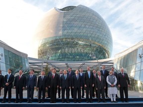 FILE - In this June 9, 2017, file photo, world leaders, including Russian President Vladimir Putin, center, pose for a photo with others as they attend the opening ceremony of the Astana Expo 2017 exhibition in Astana, Kazakstan. Minnesota is hoping to host the first World's Fair on U.S. soil in nearly 40 years, but it will have to overcome bids by Poland's third-largest city, Lodz, and the Argentine capital of Buenos Aires when a winner is selected Wednesday, Nov. 15, 2017, in Paris. (Mikhail Metzel/Sputnik, Kremlin Pool Photo via AP, File)