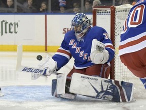 New York Rangers goalie Henrik Lundqvist deflects the puck during the first period of an NHL hockey game against the Detroit Red Wings, Friday, Nov. 24, 2017, at Madison Square Garden in New York. (AP Photo/Bill Kostroun)