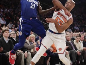 Los Angeles Clippers' Patrick Beverley (21) passes the ball away from New York Knicks' Jarrett Jack (55) during the first half of an NBA basketball game Monday, Nov. 20, 2017, in New York. (AP Photo/Frank Franklin II)