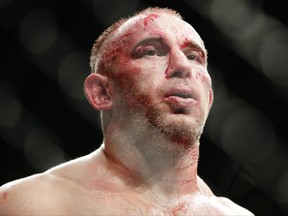 Aleksei Oleinik, of Russia, reacts during a heavyweight mixed martial arts bout against Curtis Blaydes at UFC 217, Saturday, Nov. 4, 2017, in New York. Blaydes won the fight. (AP Photo/Frank Franklin II)