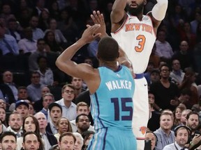 New York Knicks' Tim Hardaway Jr. (3) shoots over Charlotte Hornets' Kemba Walker (15) during the second half of an NBA basketball game Tuesday, Nov. 7, 2017, in New York. The Knicks won 118-113. (AP Photo/Frank Franklin II)