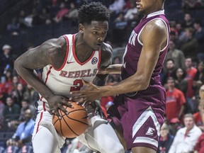 Mississippi's Marcanvis Hymon (2) is defended by Eastern Kentucky's DeAndre Dishman (2) during an NCAA college basketball game in Oxford, Miss., Monday, Nov. 13, 2017. (Bruce Newman/The Oxford Eagle via AP)