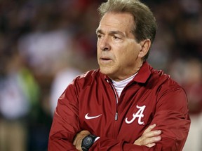 Alabama coach Nick Saban watches his team warm up for an NCAA college football game against Mississippi State in Starkville, Miss., Saturday, Nov. 11, 2017. (AP Photo/Rogelio V. Solis)