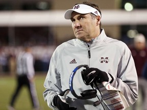 Mississippi State coach Dan Mullen gives the scoreboard in the closing seconds of the team's 31-28 loss to Mississippi in anNCAA college football game in Starkville, Miss., Thursday, Nov. 23, 2017. (AP Photo/Rogelio V. Solis)