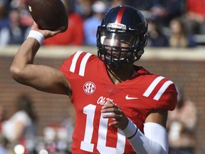 Mississippi quarterback Jordan Ta'amu (10) releases a pass during the first half of an NCAA college football game against Louisiana-Lafayette in Oxford, Miss., Saturday, Nov. 11, 2017. (AP Photo/Thomas Graning)